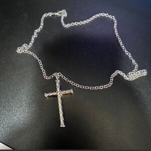 23 1/2 inch Silver cross necklace, with some weight to it and removable piece